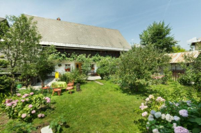 House, Garden and a Green Cat